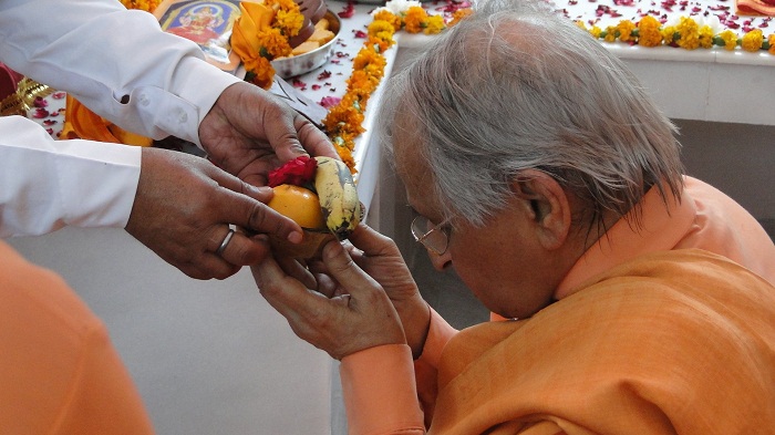 Taking Prasad in Temple